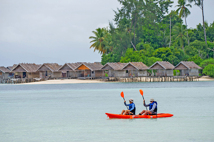 Scenic Eclipse guests kayaking in Kri Island, Raja Ampat, Indonesia