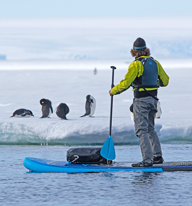 Stand-up paddleboarding in Cape Denison, Antarctica