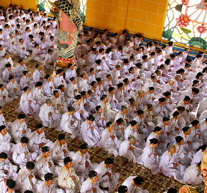 Worshippers at the Cao Dai Temple, Tan Chau, Vietnam