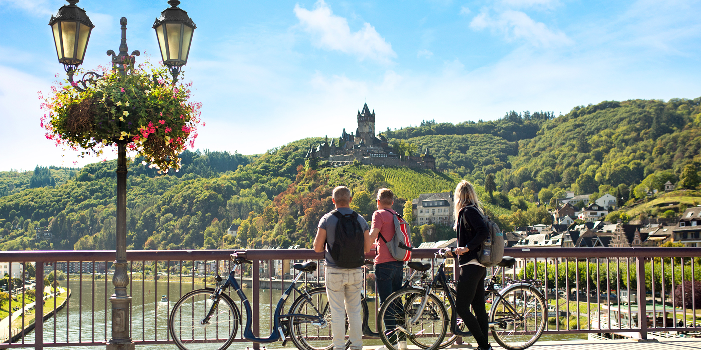 Friends with bikes looking at castle