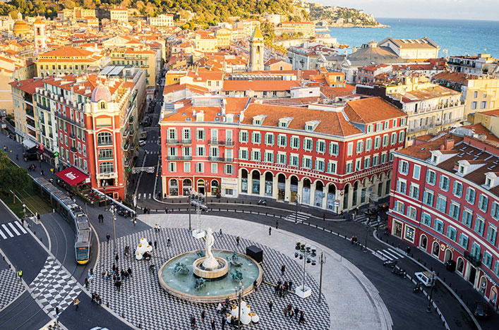 red brick building near fountain in Nice 